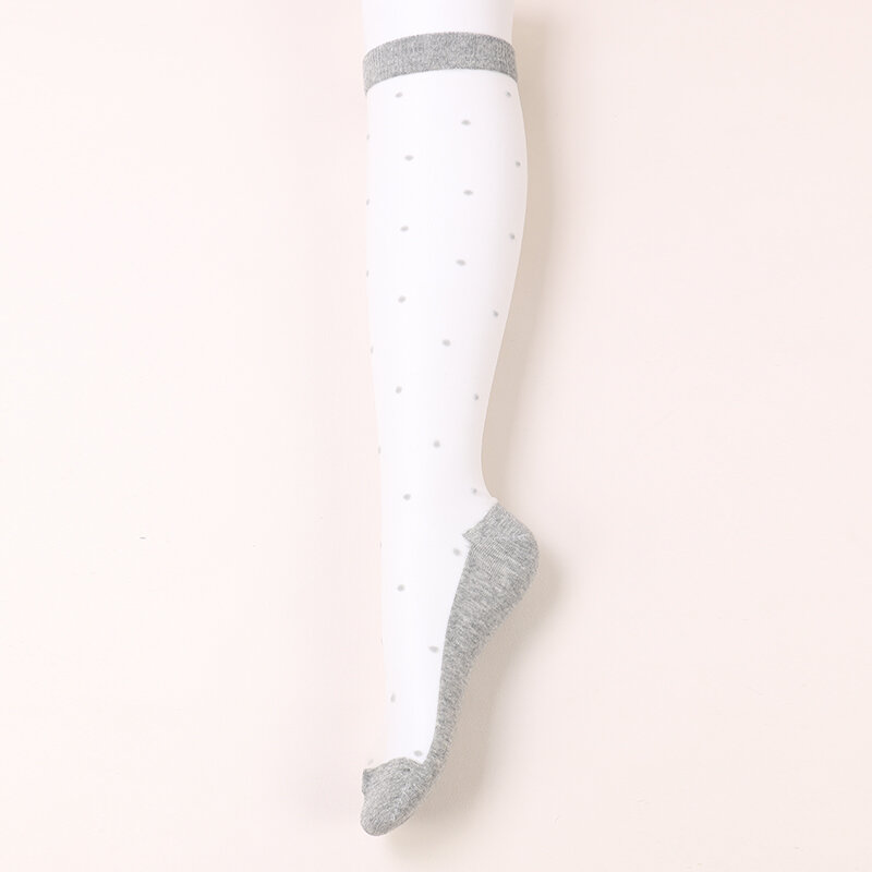 Dong Ai ถุงเท้ายาวถึงเข่าแบบบางระบายอากาศได้ดีของผู้หญิงถุงเท้าผ้าไหมเนื้อลูกวัวสีทึบมีจุดยืดหยุ่นทำจากไนลอน