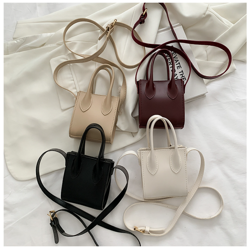 女性のための豪華なミニハンドバッグ,ショルダーストラップ付きの小さな純粋な色の合成皮革バッグ