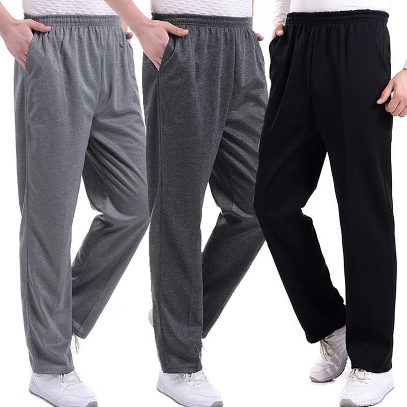 Spodnie męskie w jednolitym kolorze kieszonkowe luźne szarawary do biegania do jogi sportowe spodnie dresowe spodnie dresowe elastyczne luźne spodnie 30-42