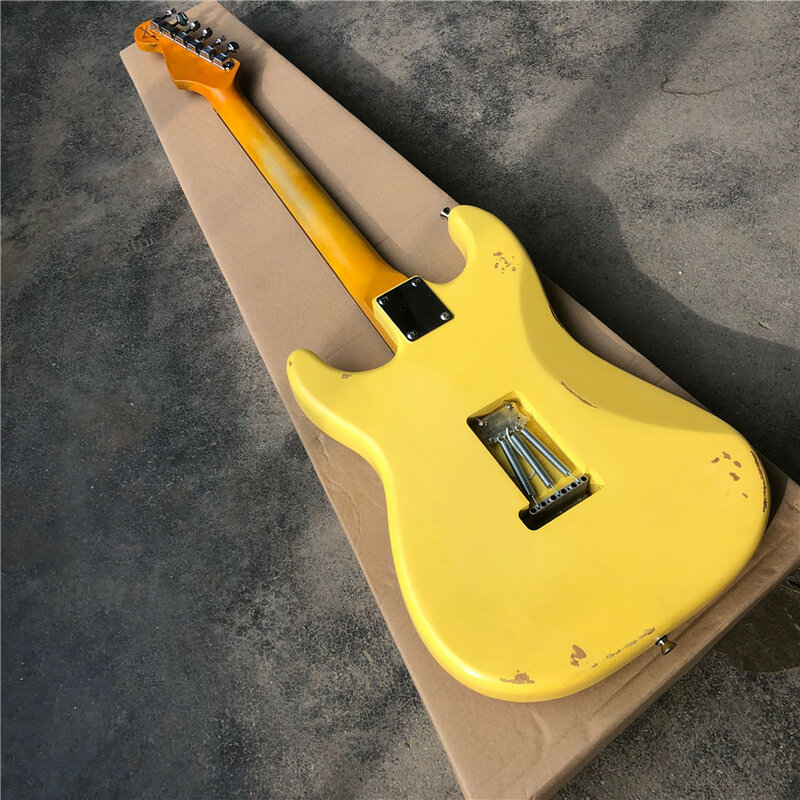 Guitarra Eléctrica reliquia, guitarra reliquia ligera, amarillo crema, tablero protector verde, tono de cola, almohada de cuerda de hueso ox, venta al por mayor