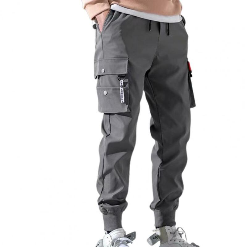 Calça de jogging casual de bolso hip-hop masculina, cor sólida, fina, primavera, verão, macacão esportivo tático masculino, quente, 50%