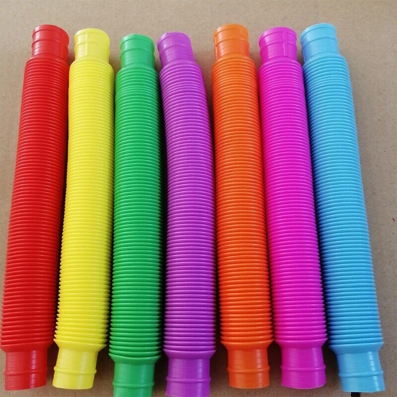 Bobina de tubo Pop de plástico colorida para niños, Juguetes Divertidos mágicos creativos para niños, juguete educativo plegable para el desarrollo temprano de 4 a 8