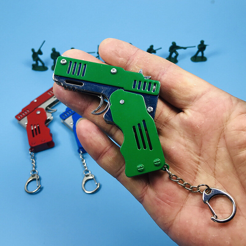 Metal cheio de borracha banda arma modelo brinquedo pistola dobrável seis explosão brinquedo arma elementar escola presente animação jogo