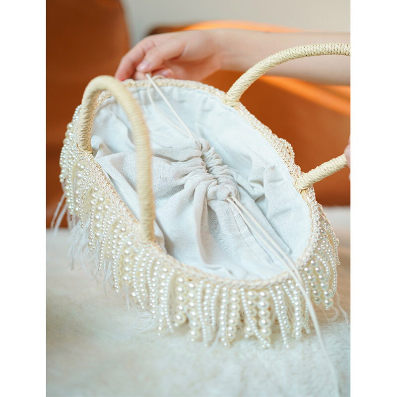 ホワイトオーストリッチフェザービーチバッグ女性2021夏の手作り真珠ビーズタッセル織わらトートバッグボヘミアハンドバッグ休日