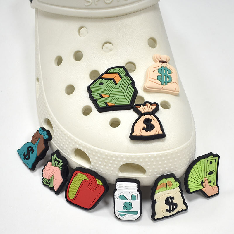 Gorące 1 szt. Cartoon dolarowe amulety do butów śmieszne DIY zielone akcesoria dopasowane chodaki z PVC ozdoby klamra dla dorosłych dzieci chłopiec X-mas prezenty