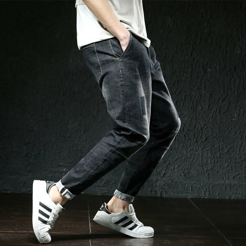 Calças de brim dos homens calças jeans elástico estiramento rasgado streetwear dos homens cintura mais tamanho grande 44 46 hip hop solto nova marca de moda