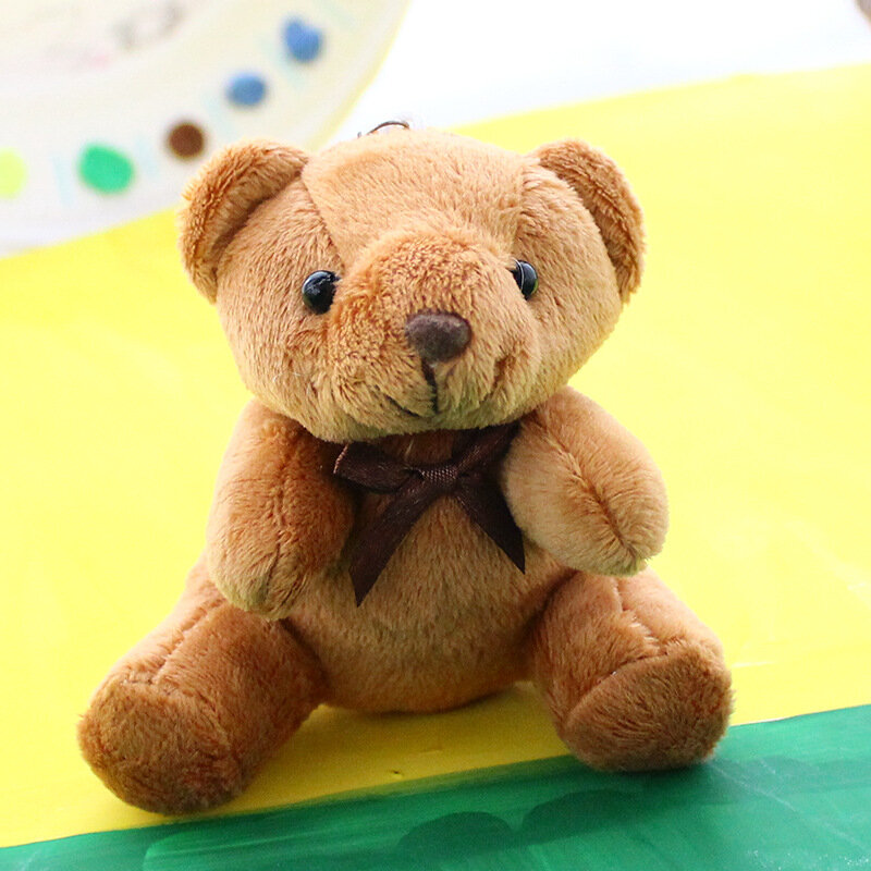 Oso de peluche Kawaii de 10CM para niños, oso de peluche suave con pajarita, bolsa para muñeca, colgante, decoración automática, regalo de cumpleaños