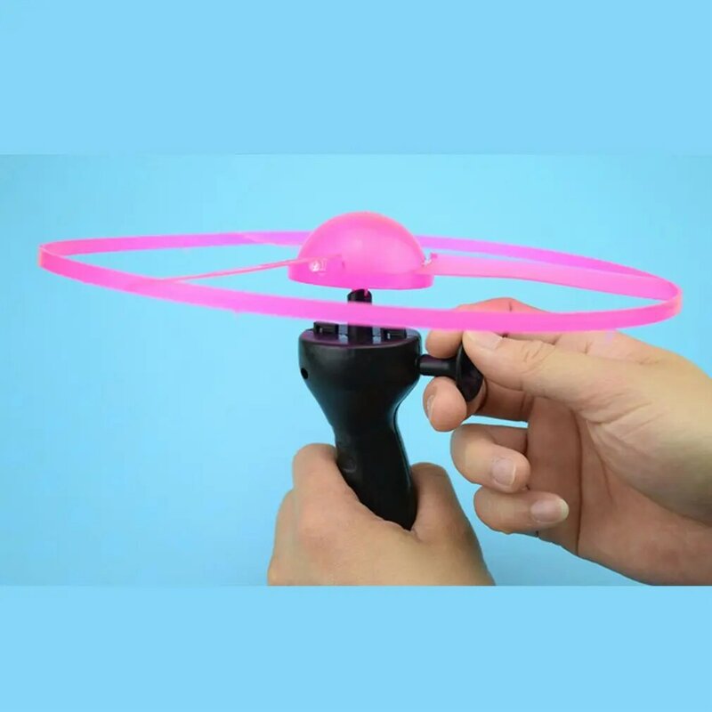 1 pz divertente volante maniglia a spinta a mano tirare filo filatura volantino luminoso volante UFO maniglia leggera Flash giocattoli volanti per giocattoli per bambini