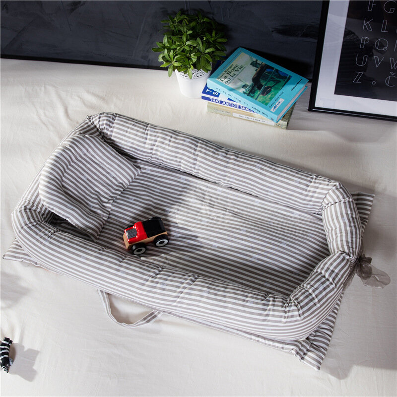 Babynest-ポータブルトラベルベッド,枕付きベビーベッド,取り外し可能なバンパークッション