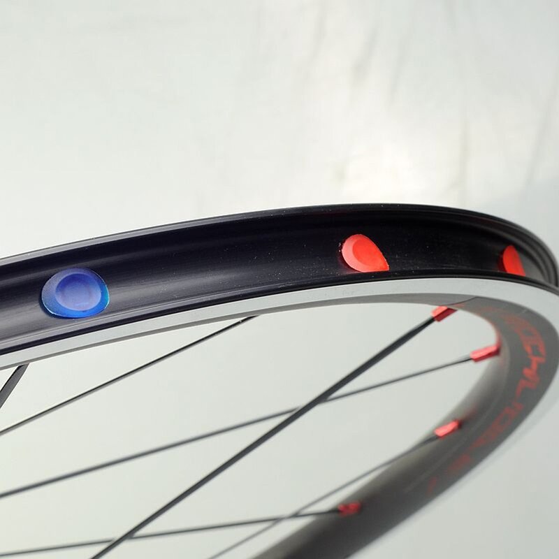 100 pz/bottiglia MTB Road Bike Rim Plug cerchi con occhielli tappi per ruote per biciclette cuscinetto per pneumatici per bici anello in acciaio tappi per fori parti di veicoli