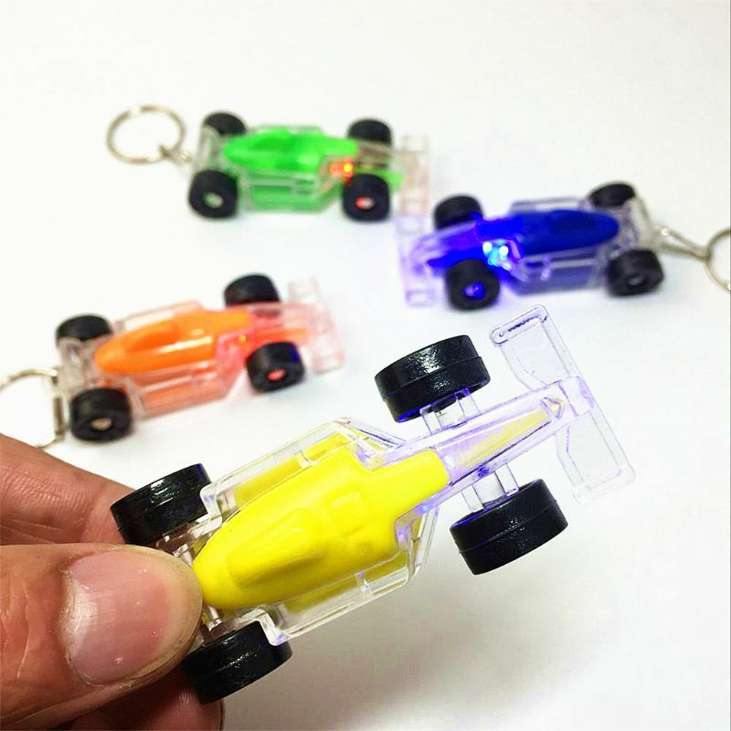 Mini Racing LED Licht-Up Spielzeug Keychain Party Favors Kinder Spielzeug Geschenk Gadgets Tasche Anhänger