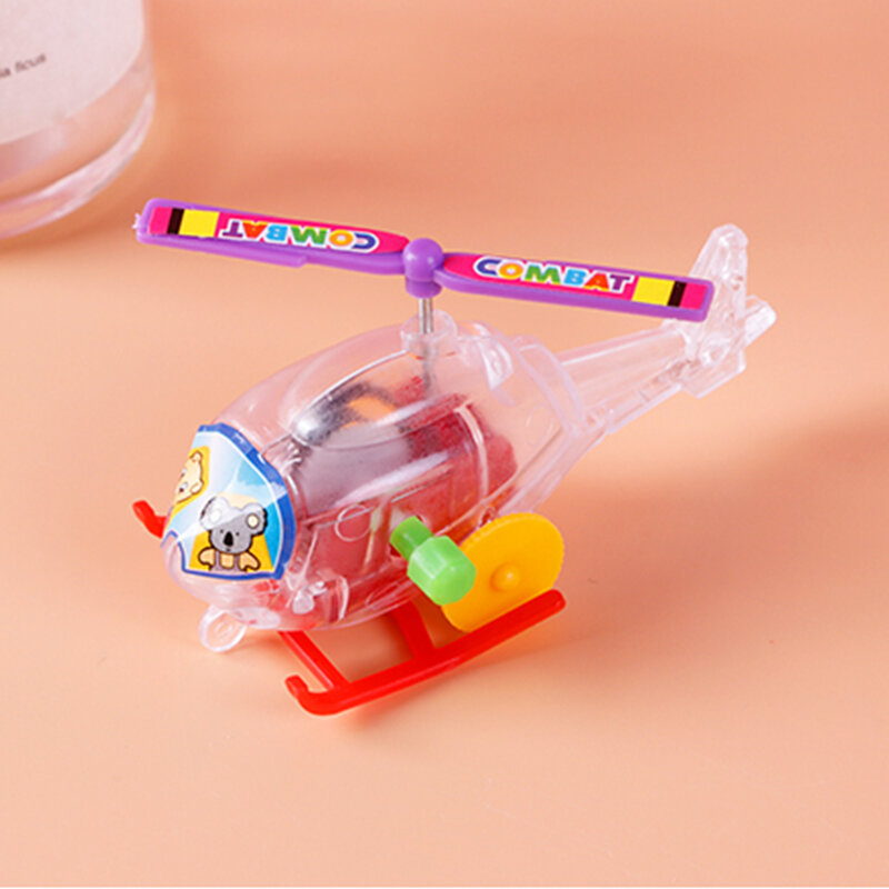 Nuovo e interessante giocattolo a orologeria a carica trasparente mini elicottero aereo giocattolo a strappo giocattolo per gattonare infantile per bambini