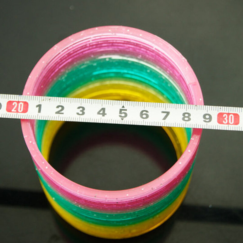 Juguetes Divertidos de círculo de arcoíris para niños, bobina de resorte de plástico plegable, juguetes mágicos creativos, Desarrollo Temprano educativo, 1 pieza