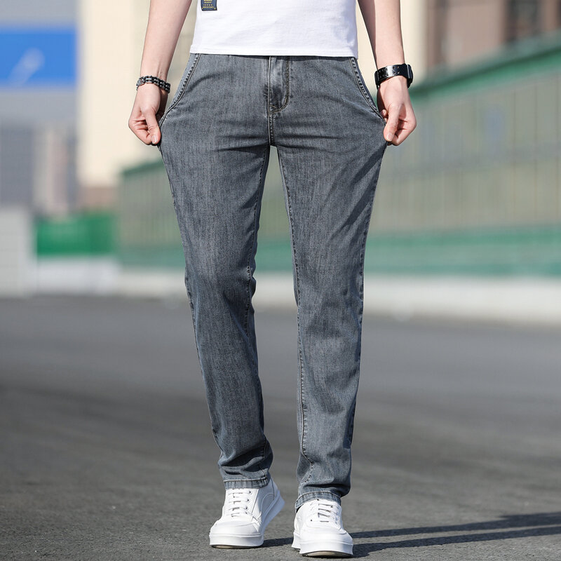 2023 estate nuovi Jeans grigi elasticizzati larghi da uomo moda Casual Stretch pantaloni in Denim a gamba dritta maschile marca azzurro