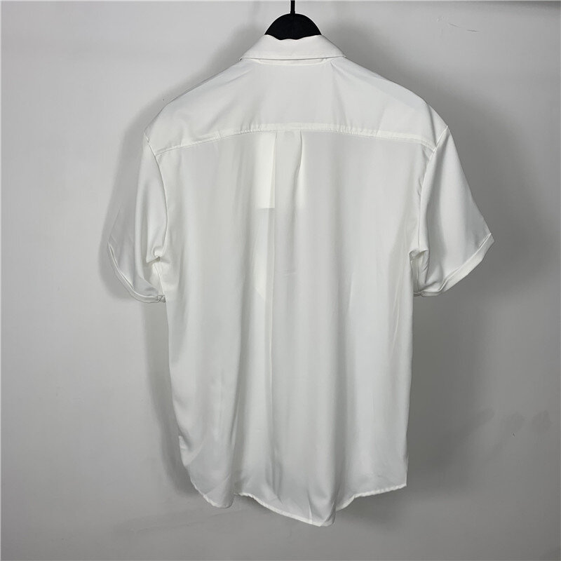Męska koszulka z krótkim rękawkiem lato nowy jednolity kolor klapa duży rozmiar koreański wersja luźna moda osobowość magia z guzikami wzorem