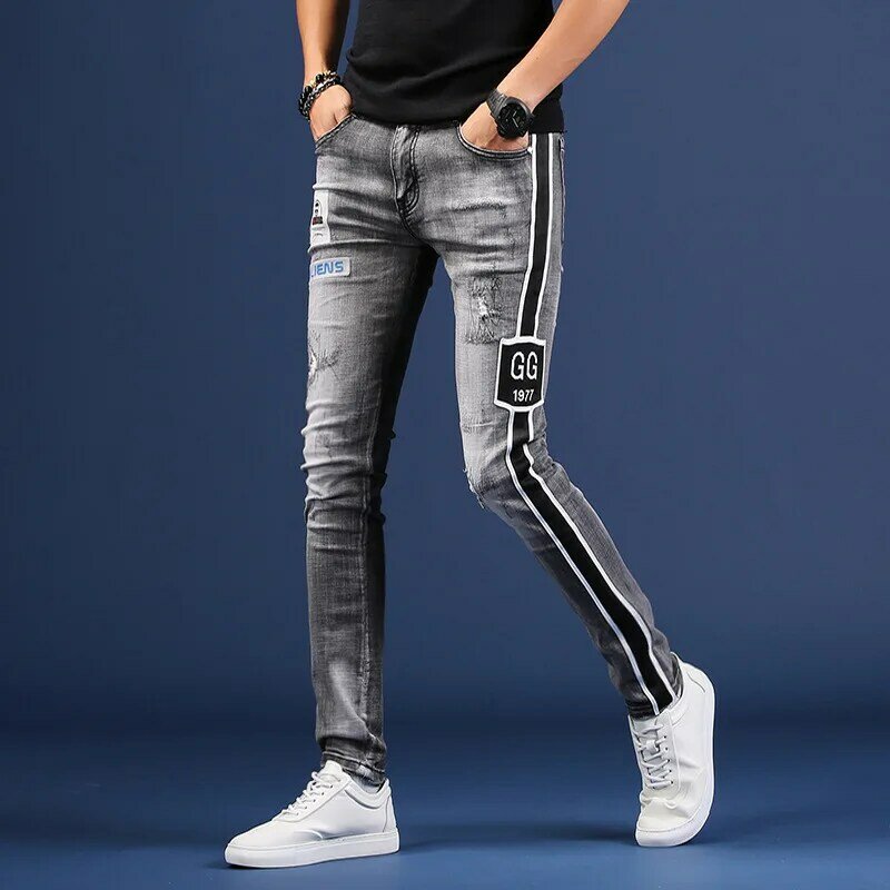 Koreańska wersja drukowane podarte dżinsy męskie hafty szczupłe spodnie typu casual stretch spodnie dżinsowe cztery pory roku dżinsy.
