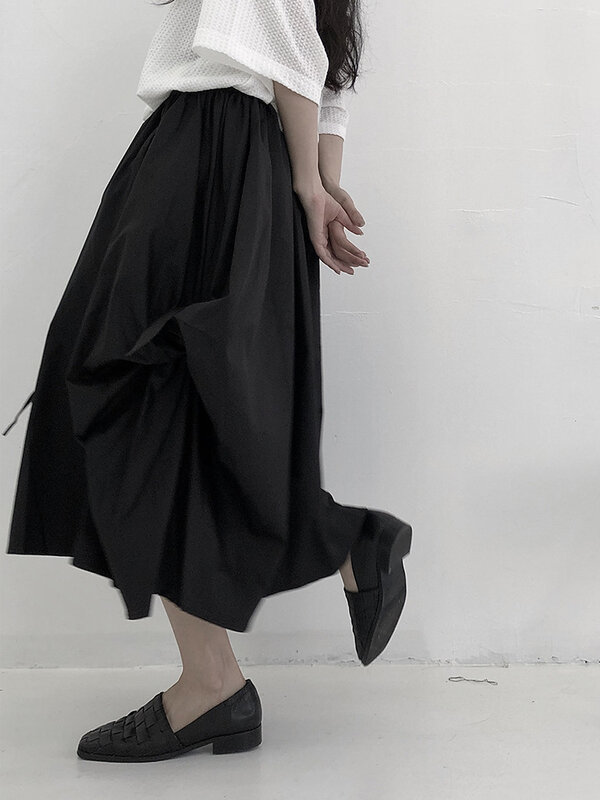 تنورة السيدات الصيف جديد الظلام شخصية مطوي هونغ كونغ نمط الرجعية أزياء فضفاضة تنورة كبيرة الحجم