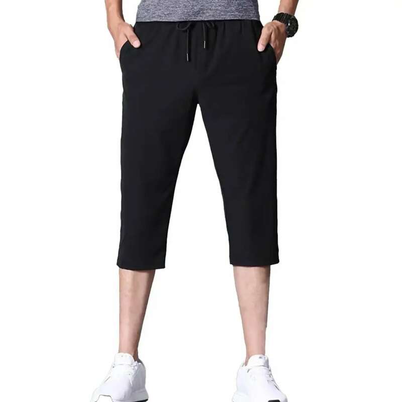 Pantalones cortos informales para hombre, Shorts elásticos de Color sólido a la moda, con bolsillos y cordón, de secado rápido, talla grande