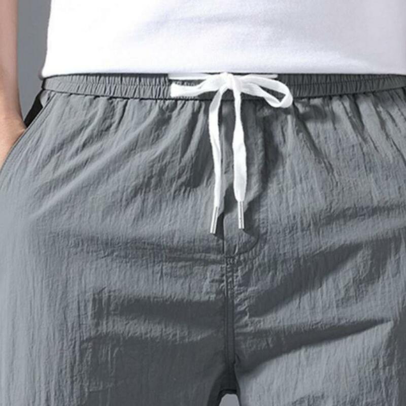 พลัสกางเกงขนาดผู้ชายสีทึบกระเป๋าสายรัดข้อเท้า Tie Cargo กางเกงกางเกงฤดูร้อนที่ร้อนแรงที่สุดน้ำหนักกางเกง
