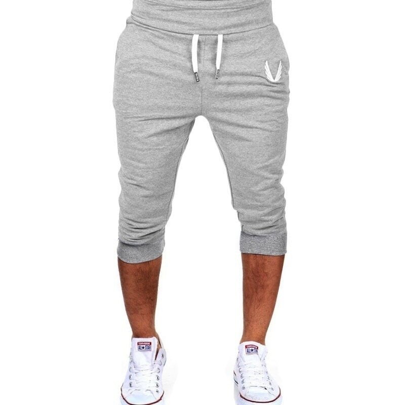 Zogaa 2019 nueva moda hombre hasta la rodilla Color Patchwork Hip Hop Joggers pantalones de algodón Casual moda Pantalones verano cómodo