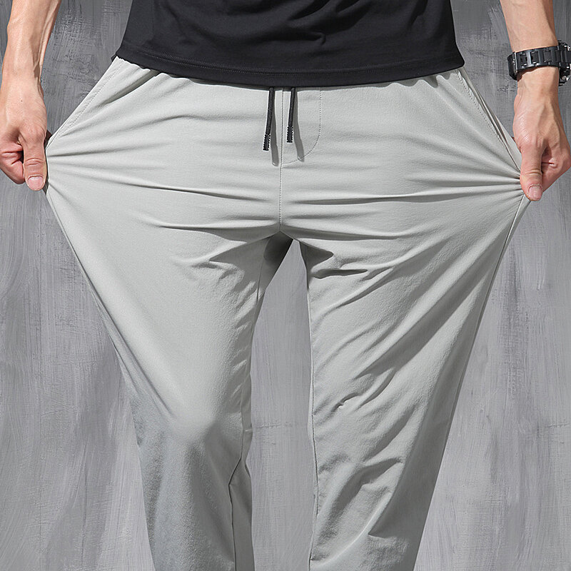 Новинка 2024, эластичные брюки из ледяного шелка в Корейском стиле, тонкие повседневные мужские свободные спортивные штаны на все четыре сезона, 9 точек, большие размеры, для весны