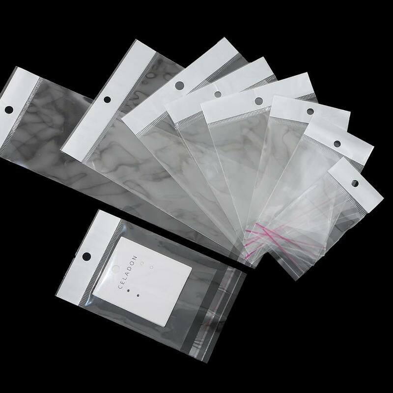 100Pcs Self Adhesiveพลาสติกกระเป๋าOPPโพลีแพ็คกระเป๋าHang Holeขายปลีกบรรจุภัณฑ์เครื่องประดับกระเป๋า