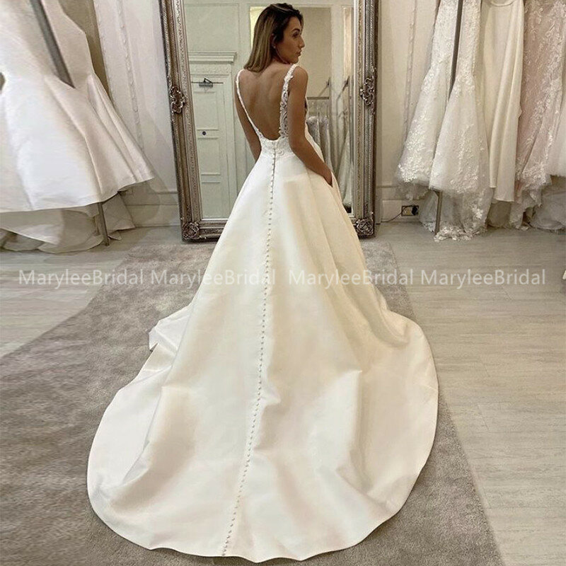 Plunging V-neckline Wedding Dress with Thin Straps A-line Lace Appliqués Sheer Bodice Bridal Gowns With Pockets Low Scoop Back
