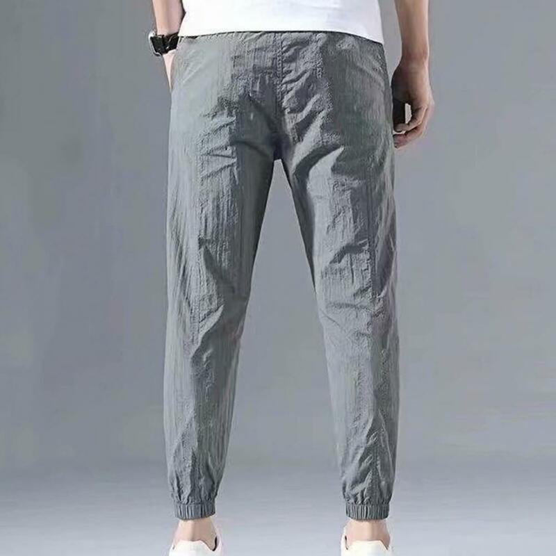 Męskie spodnie na co dzień Plus Size męskie jednokolorowe kilka kieszeni sznurkiem kostki krawat spodnie Cargo spodnie letnie najgorętsze spodnie waga