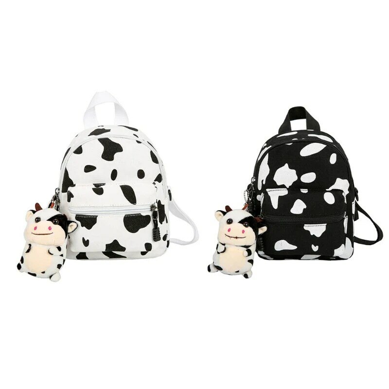 Mini mochila de lona con colgante de felpa, mochila con estampado de vaca para mujeres y niñas