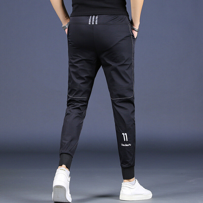 สีดำสบายๆกางเกงผู้ชายแฟชั่นกีฬา Joggers ฤดูร้อน Streetwear บาง Slim Fit กางเกง Drawstring