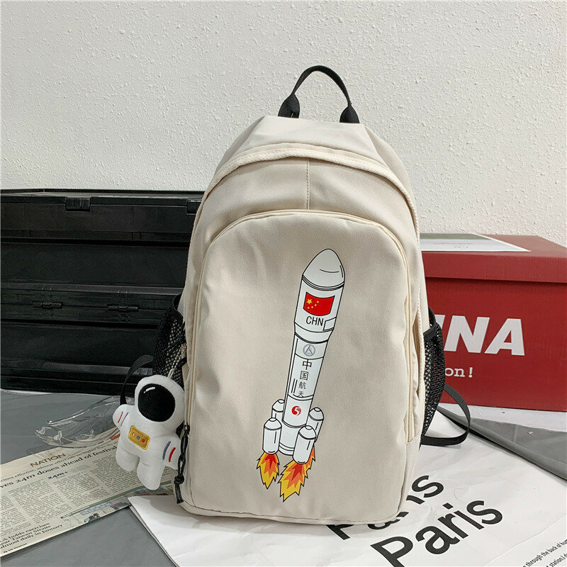 Mochila Kawaii con patrón de cohete de dibujos animados Unisex y gran capacidad mochila escolar para pareja de estudiantes para enviar colgante de muñeca