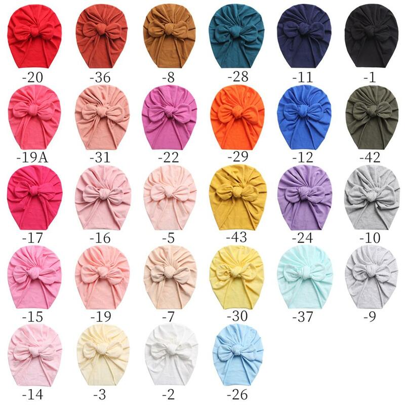 Berretti di cotone per bambini solidi cappelli di turbante Bowknot con orecchio di orso carino dolce morbido 0-4T cappellini elastici per neonato