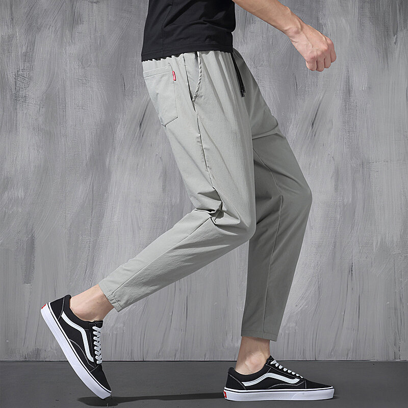 Новинка 2024, эластичные брюки из ледяного шелка в Корейском стиле, тонкие повседневные мужские свободные спортивные штаны на все четыре сезона, 9 точек, большие размеры, для весны