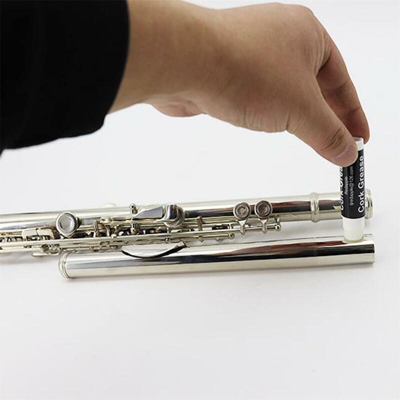 Cuidado diário da vara da graxa da cortiça do saxofone para a relação do instrumento do clarinete
