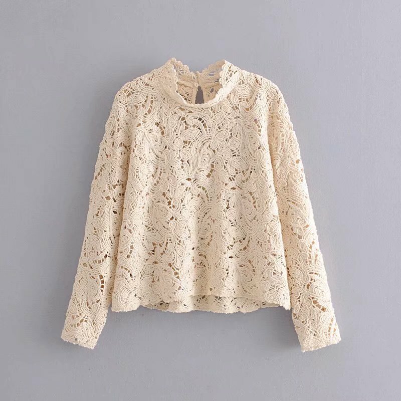 Autumn and winter ladies' new hollow solid color round neck long sleeve short knit sweater