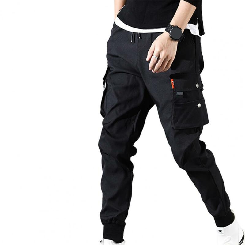 Pantalones Cargo con múltiples bolsillos para hombre, cintura elástica y cordón, Color sólido, delgados, pies de haz, guapo, 2024