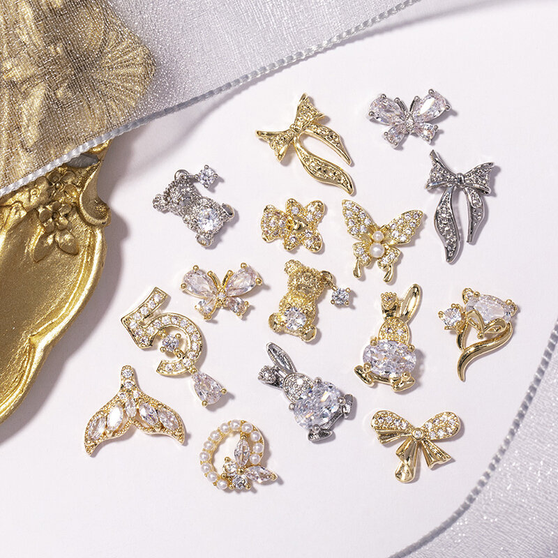 Decoración de uñas de lujo de aleación de diamante de cristal de oso de mariposa de circón de calidad, decoración de uñas de oro, cadena de moda, joyería de borla, 2 piezas