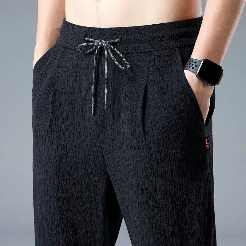 Letnie lodowy jedwab spodnie męskie lniane spodnie dresowe na co dzień męskie szybkoschnący sportowy spodnie haremowe do kostek 2023 moda uliczna