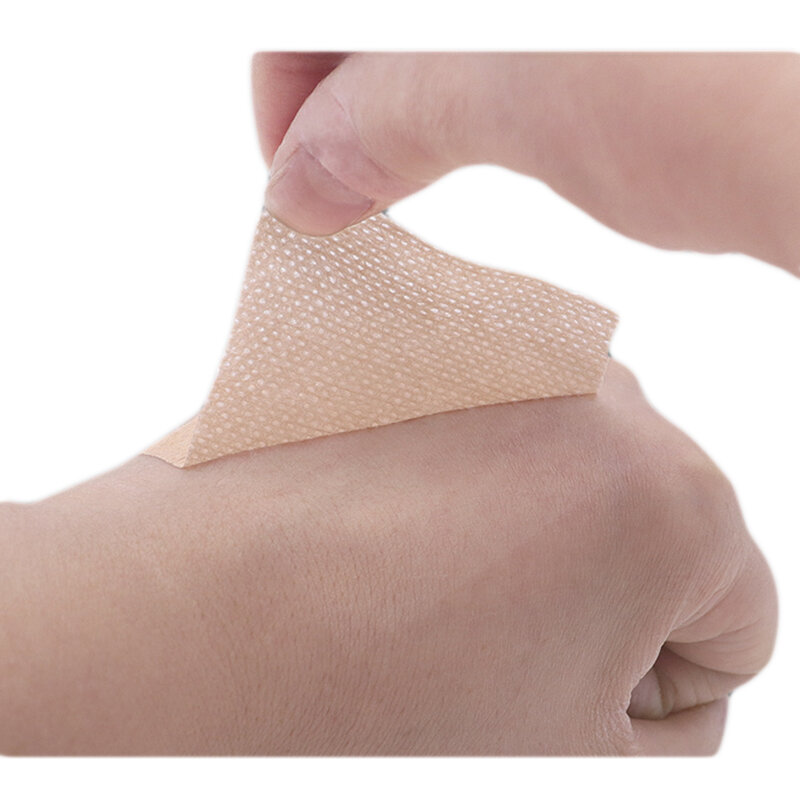 1 rotolo di nastro traspirante Non tessuto medico di colore della pelle 5cm x 10m per fissaggio della medicazione delle ferite assistenza domestica quotidiana