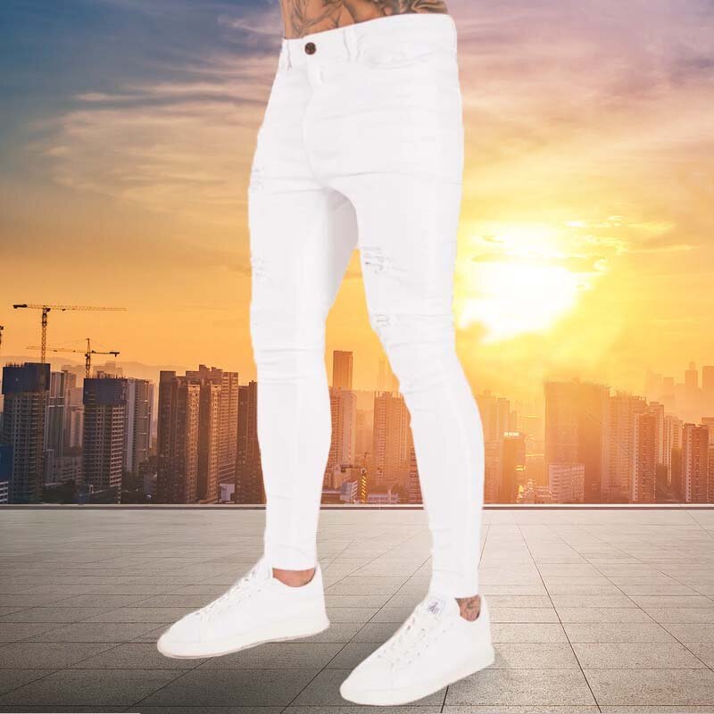 جينز رجالي جديد موضة 2023 سراويل هيب هوب بيضاء ضيقة ممزقة بلون نقي من قماش الدنيم المطاطي سروال رجالي ضيق غير رسمي بخصر للركض