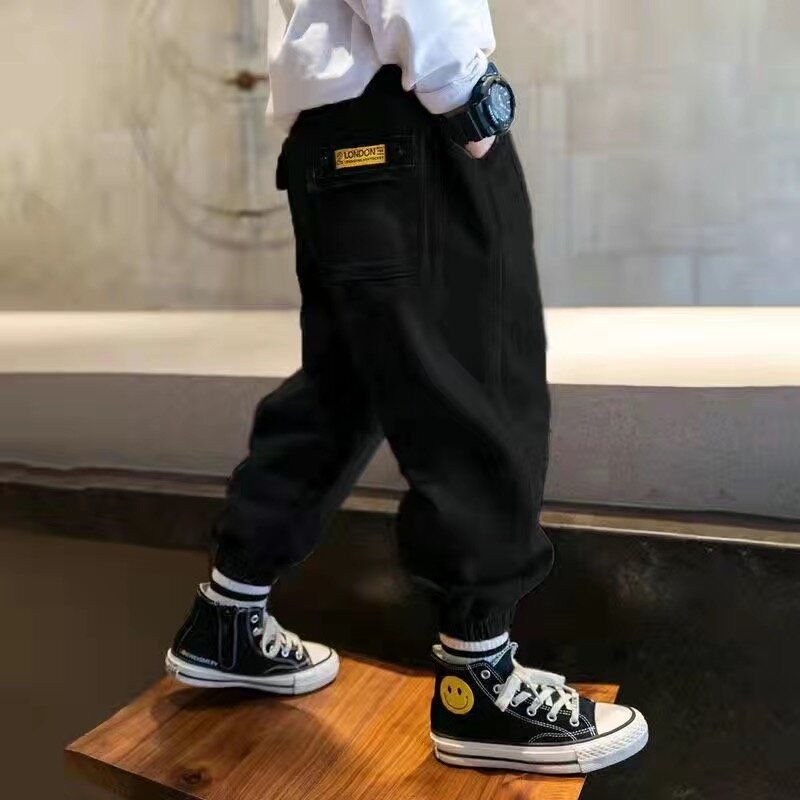 Gorąca sprzedaż chłopięce spodnie Cargo 2022 nowe bawełniane koreańskie spodnie na co dzień dzieci wiosna jesienne spodnie łączenie dużych kieszeni 4-13 lat