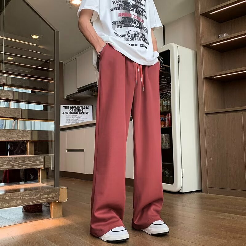 Pantalones casuales para hombre, versión coreana de la tendencia, pantalones de chándal guapos con colgante, novedad de verano 2024