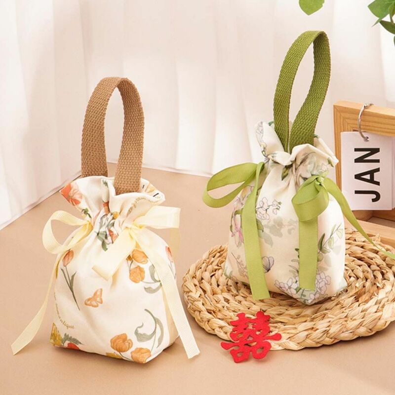 Borsa con coulisse in tela floreale borsa da polso con fiore piccolo di grande capacità in stile coreano borsa da imballaggio Jewerly borsa Bowknot