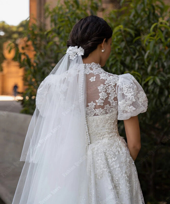 Puszyste ręcznie robione suknie ślubne z krótkimi rękawami na szyję błyszczące naklejki ślubne suknie podłogowe Mopping formalne Party Vestidos De Novia