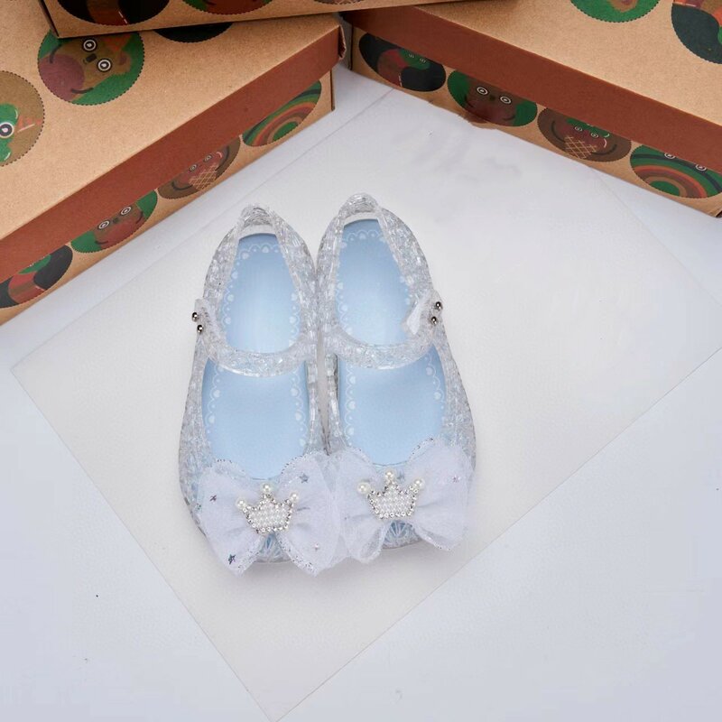 Zapatos de gelatina de cristal para niños, sandalias de playa suaves y fragantes, con lazo y corona de princesa, novedad de 2024, HMI156