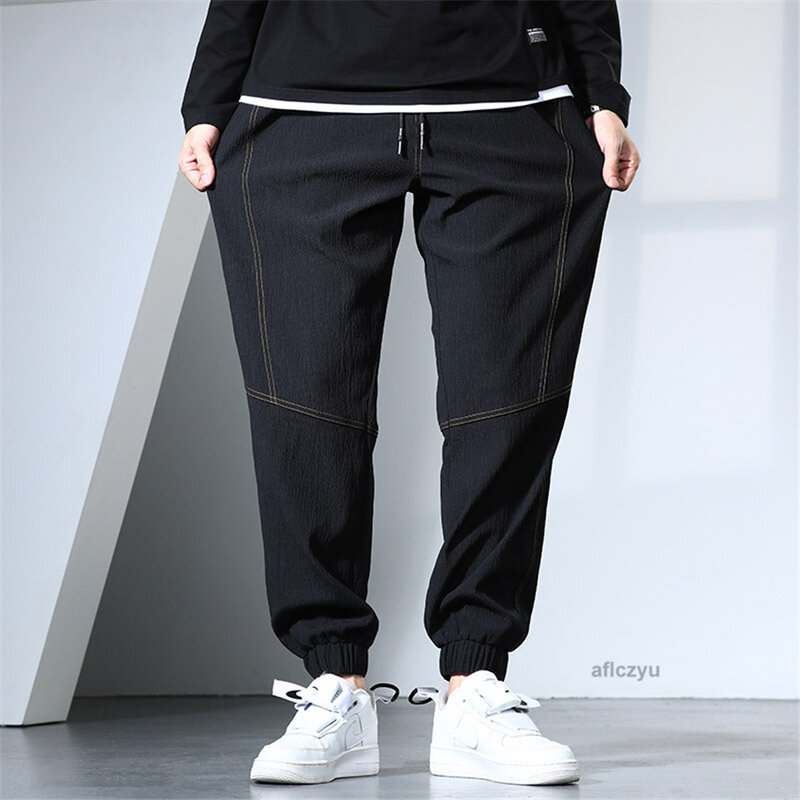 Pantalones de correr negros para hombre, pantalón informal de moda, Color sólido, 6XL talla grande, Verano