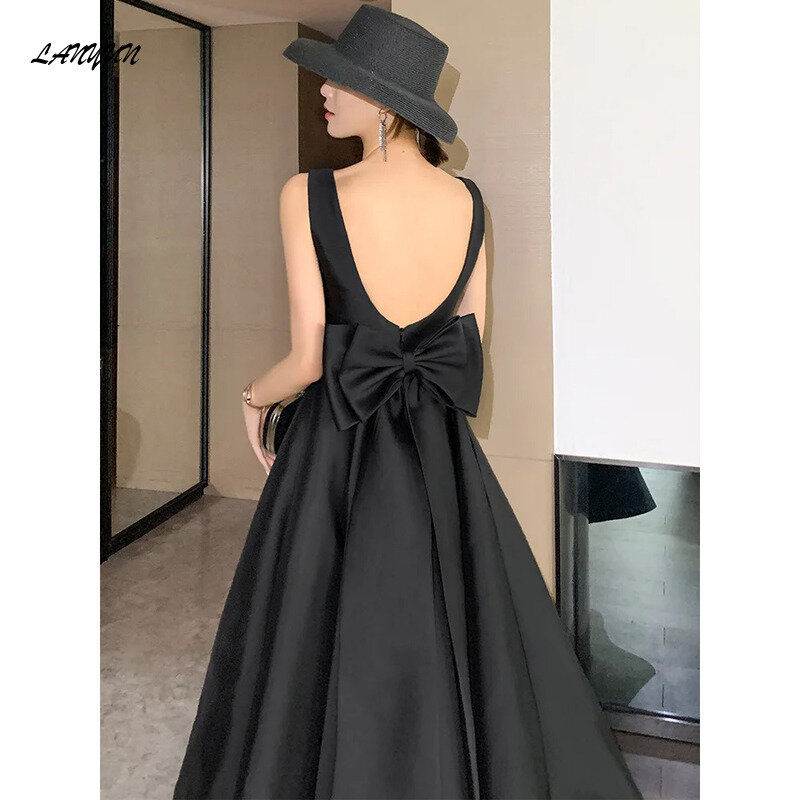Vestido largo de noche con espalda descubierta para mujer, traje Sexy con lazo grande, color negro, elegante, para fiesta de cumpleaños, 2024