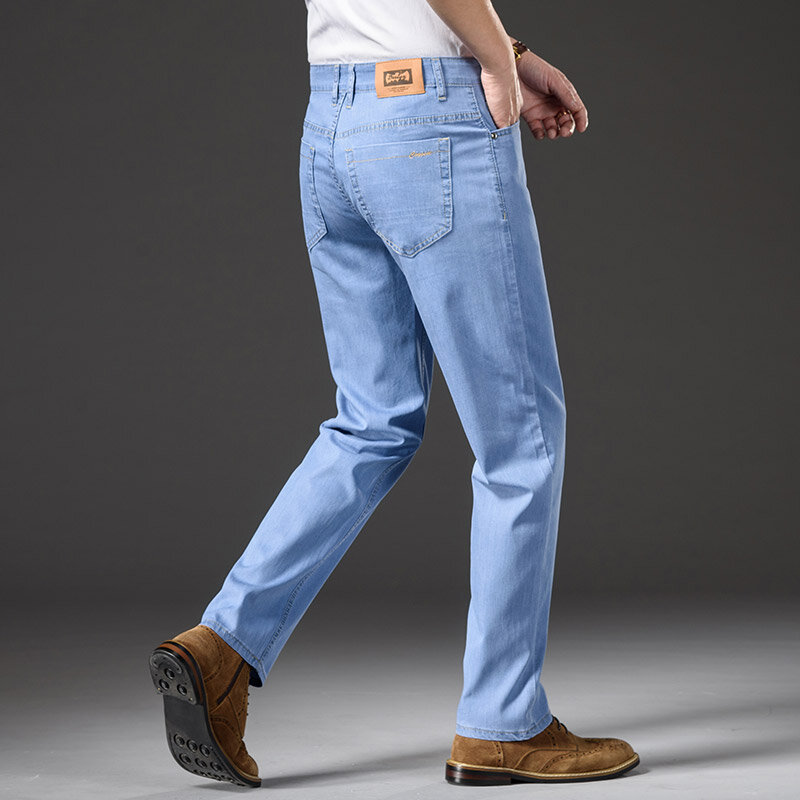 Shan bao verão marca masculina reta solta calças de brim leve de alta qualidade lyocell estiramento negócios casual cintura alta fina jeans