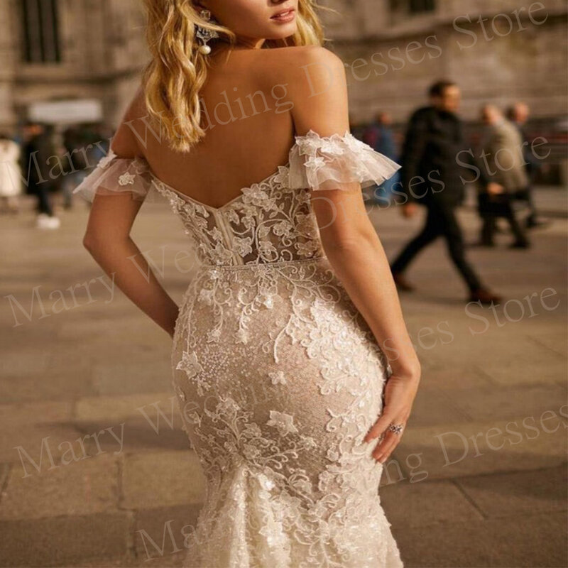 レースのアップリケが付いたマーメイドのウェディングドレス、裸の肩、背中の開いた花嫁のドレス、ノースリーブのドレス、セクシーで豪華