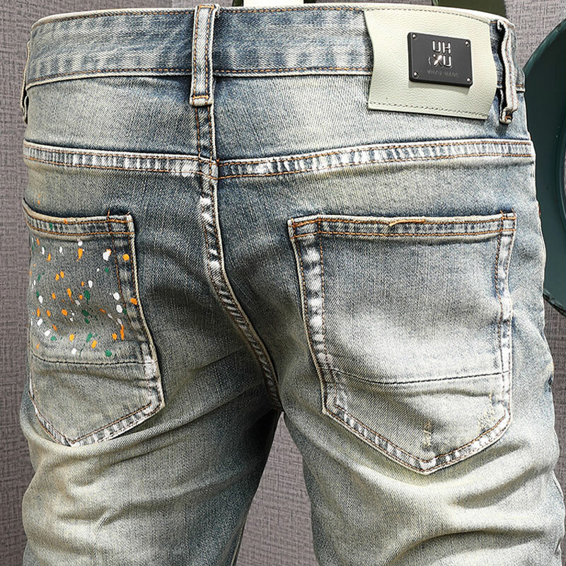 High Street Fashion celana Jeans pria Retro dicuci biru Stretch Slim Fit robek Jeans Pria dilukis desainer Hip Hop celana Denim Hombre